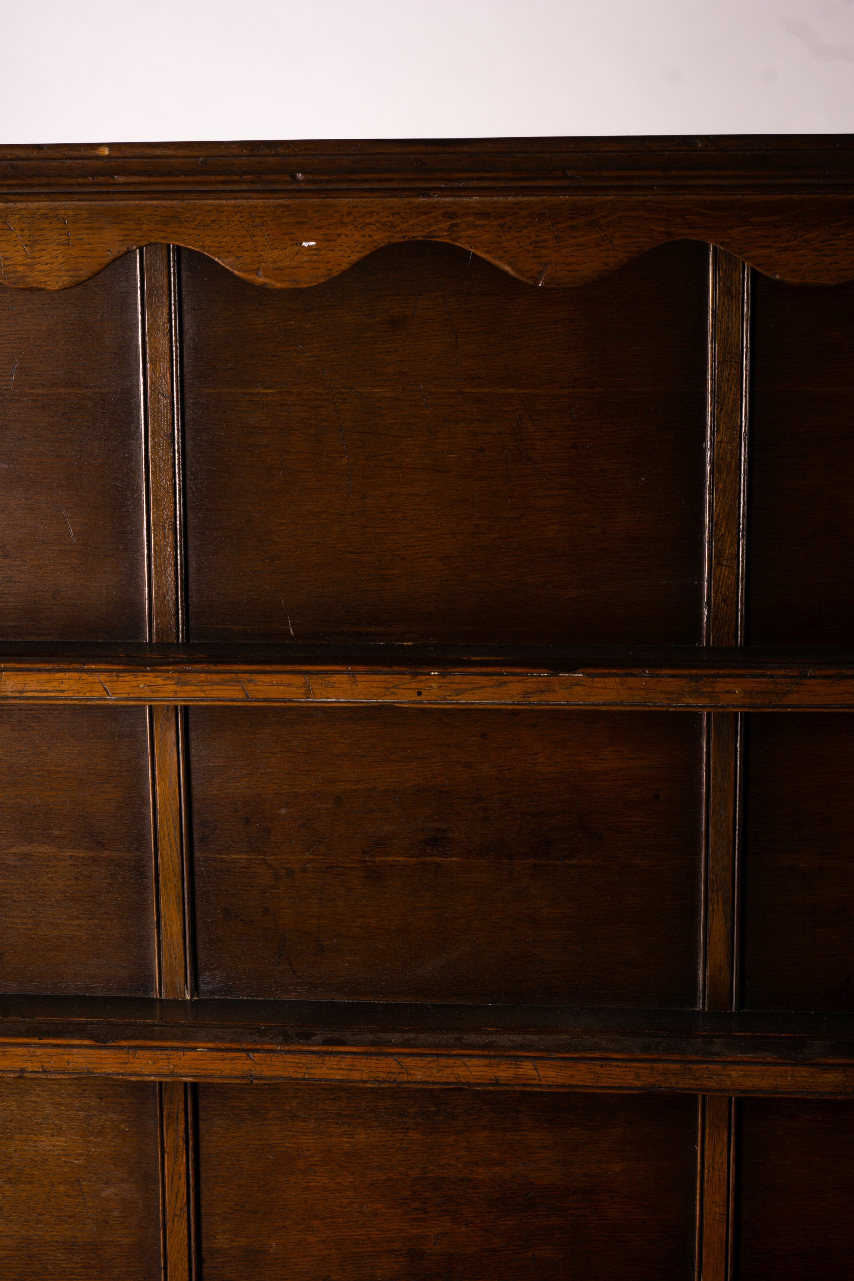 An 18th century style carved oak dresser, width 124cm, depth 46cm, height 175cm